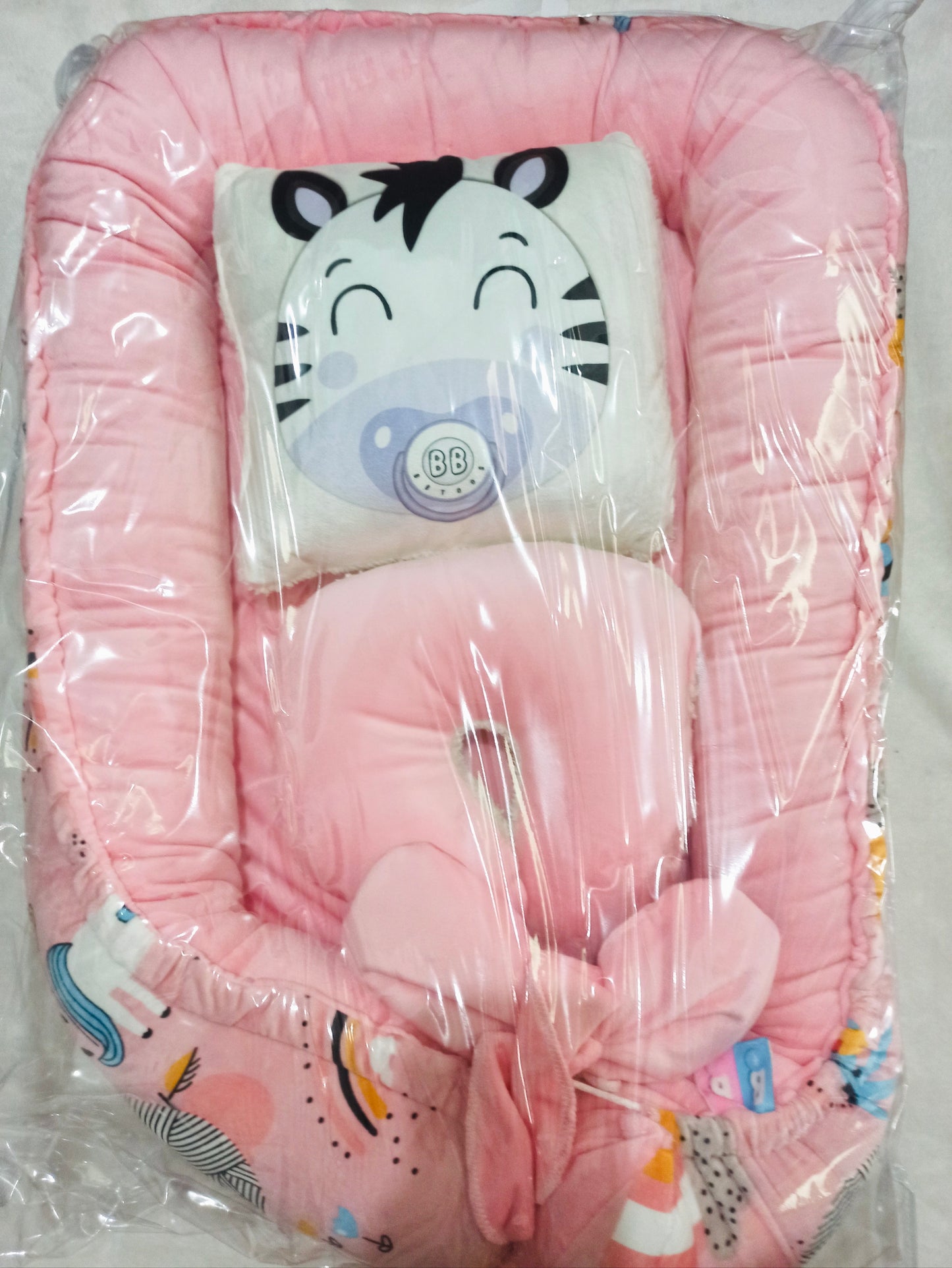 Nido con 2 almohadas