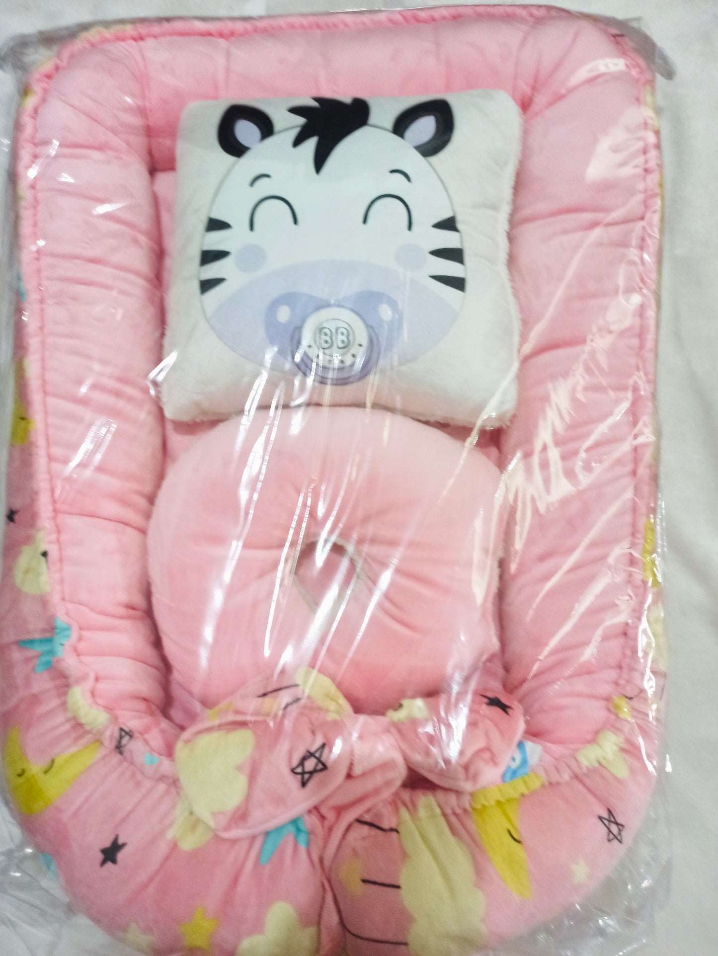 Nido con 2 almohadas